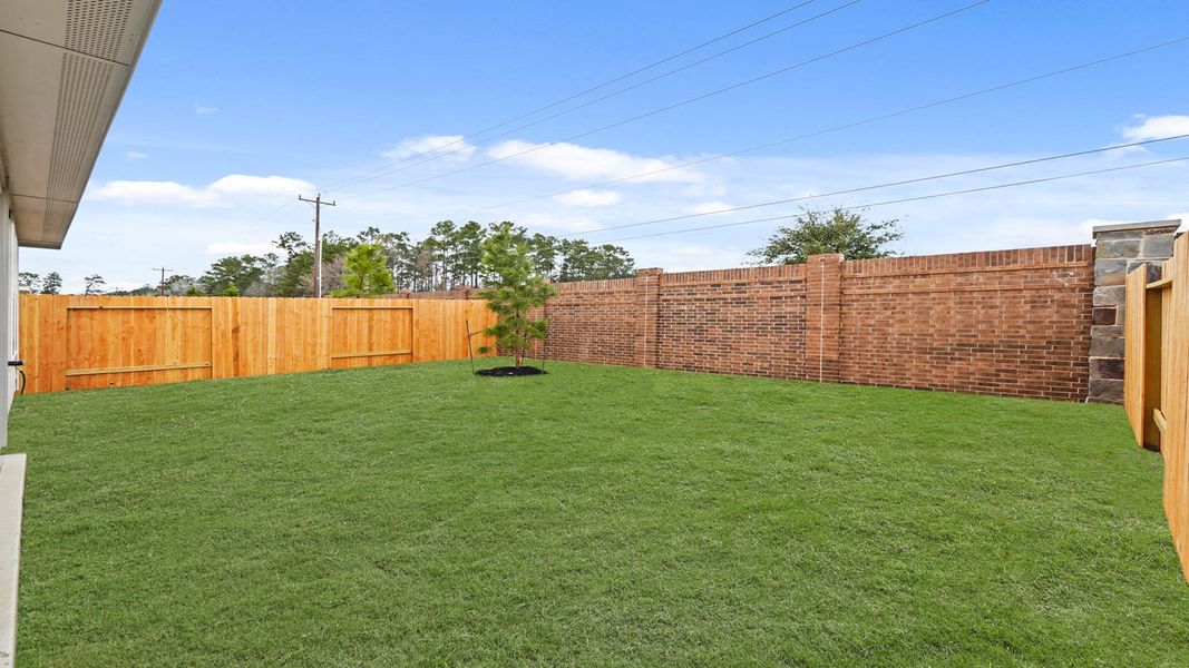 Exterior details and patio area of a home in Presswoods, Splendora (Image 3).