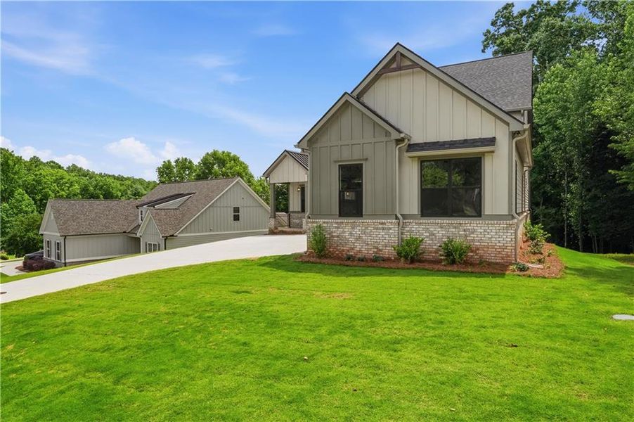 Front exterior of a new home in , Jefferson, GA, highlighting curb appeal (Image 28).
