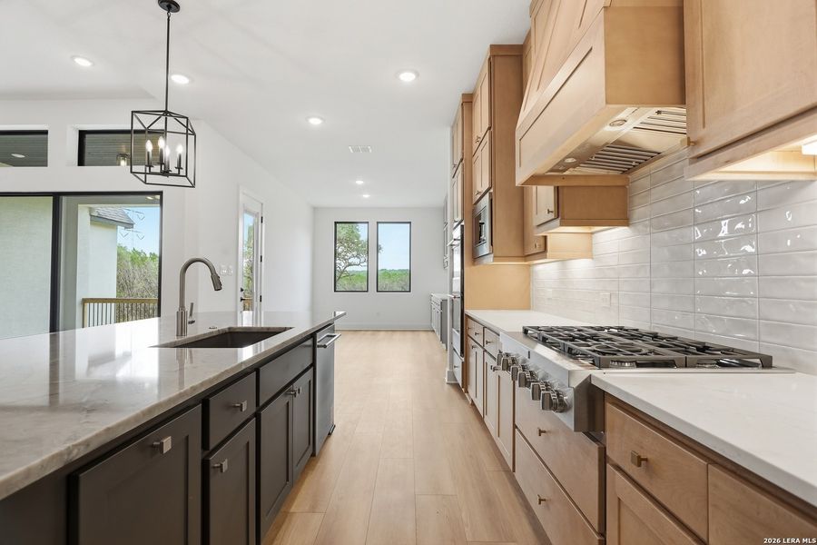 Furnished interior view inside a new home in Enchanted Bluff, San Antonio (Image 14).