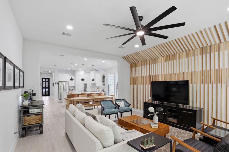 A seamless flow connects the living, dining, and kitchen areas, perfect for keeping everyone together.