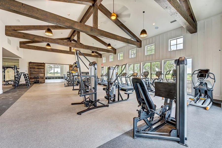 Exercise room with beam ceiling, high vaulted ceiling, and recessed lighting