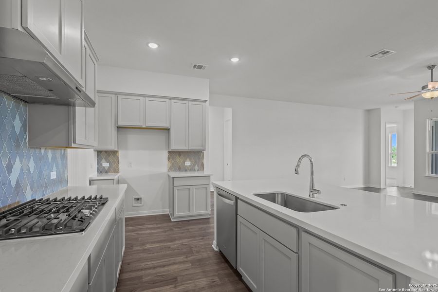 Furnished interior view inside a new home in Homestead 65', Schertz (Image 10).