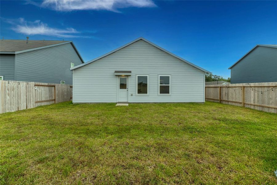 The large fenced backyard offers tons of room for the kids or pets to run and play. The large fenced backyard offers tons of room for the kids or pets to run and play.