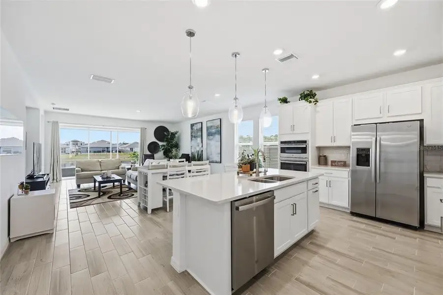 Furnished interior view inside a new home in Westview Community Group Page, Kissimmee (Image 4).