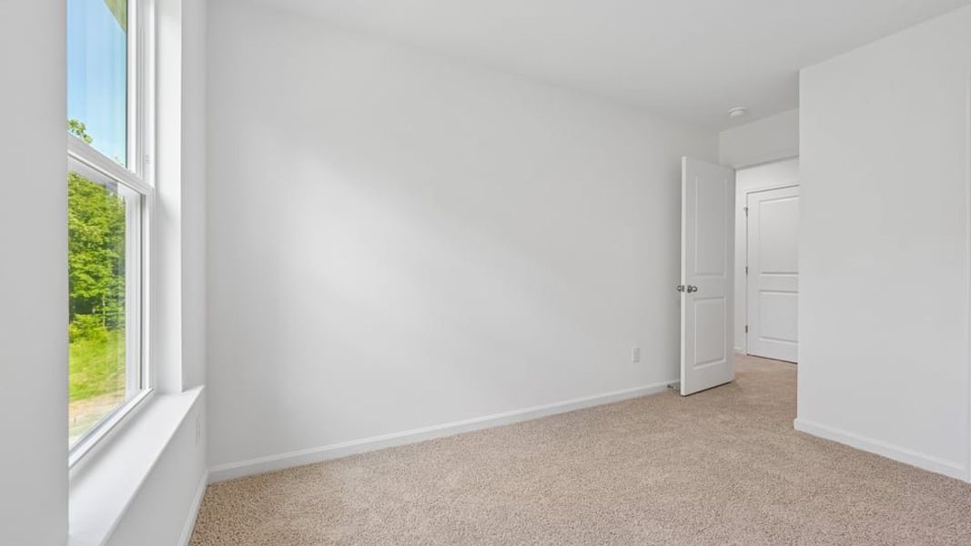 Spacious, unfurnished interior of a new home in The Townes at Belle Grove, Wendell (Image 14).