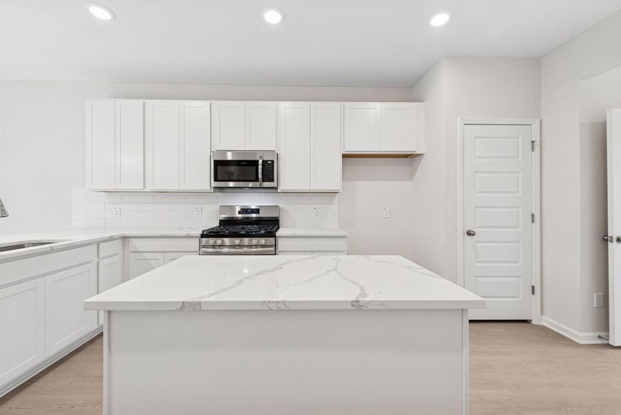 The Cardinal II- Kitchen. Photos of home shown are for illustration only; actual features, colors, and upgrades may vary. The Cardinal II- Kitchen. Photos of home shown are for illustration only; actual features, colors, and upgrades may vary.