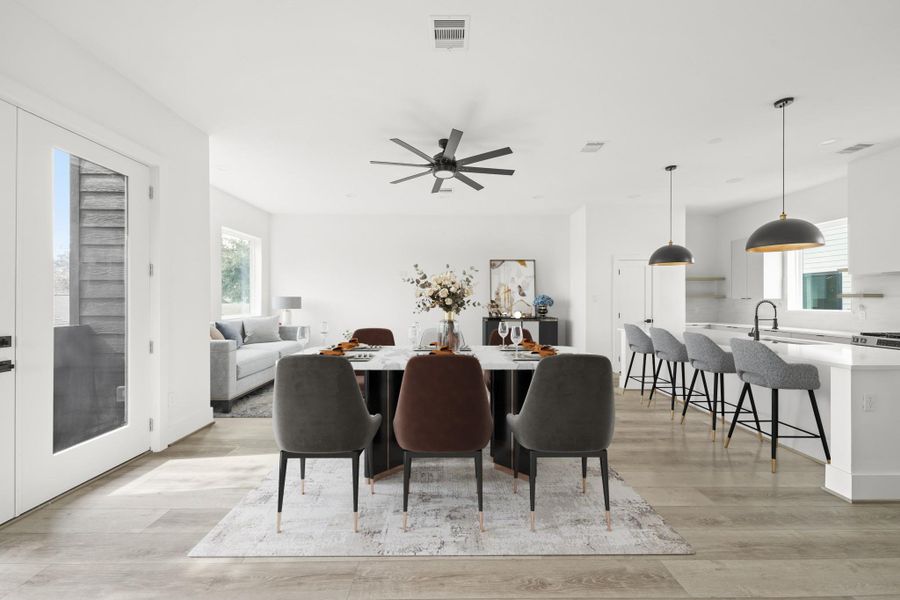 Enjoy the dining area with a French door leading outside to the balcony but also opens to the family room and kitchen offering a connected layout with flexible furniture placement opportunities. This photo has been virtually staged. Enjoy the dining area with a French door leading outside to the balcony but also opens to the family room and kitchen offering a connected layout with flexible furniture placement opportunities. This photo has been virtually staged.