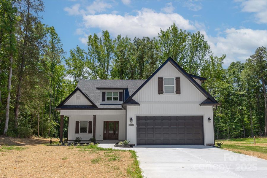 Front exterior of a new home in , Stanley, NC, highlighting curb appeal (Image 1).