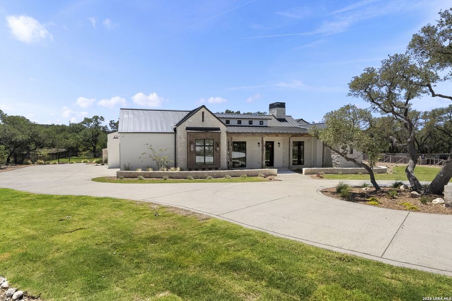 Front exterior of a new home in , Boerne, TX, highlighting curb appeal (Image 26). Front exterior of a new home in , Boerne, TX, highlighting curb appeal (Image 26).