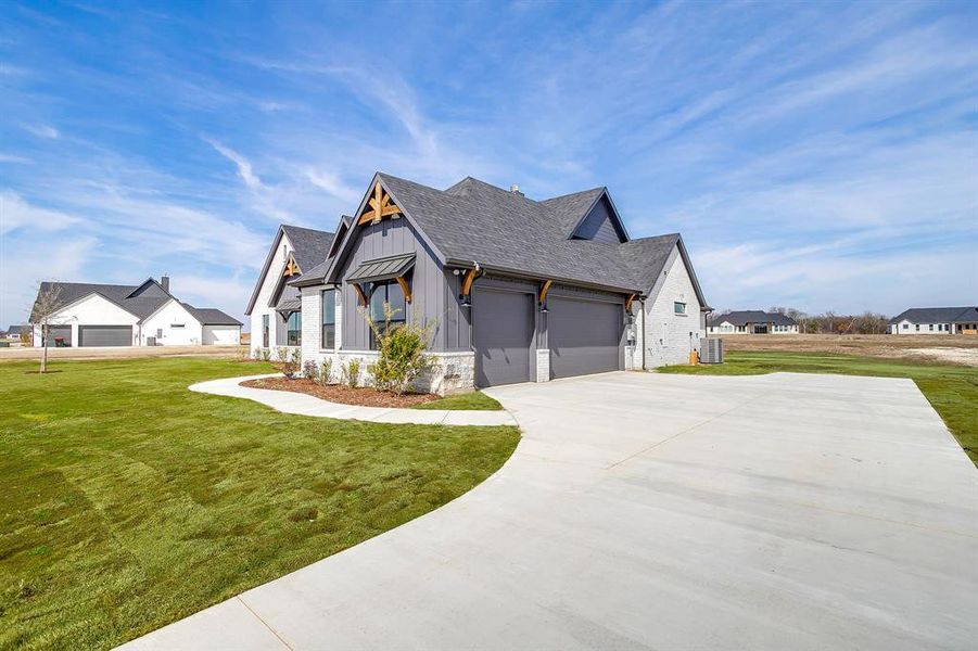 Front exterior of a new home in , Waxahachie, TX, highlighting curb appeal (Image 2). Front exterior of a new home in , Waxahachie, TX, highlighting curb appeal (Image 2).