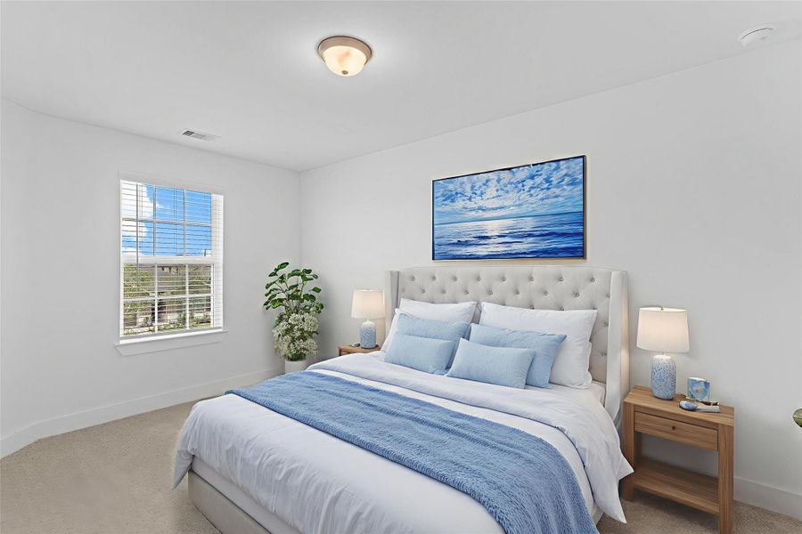 Another secondary bedroom upstairs offers a peaceful retreat with a large window, clean white walls, and ample space for a bed, desk, or additional furniture. Guest bedroom is on the left wing of the home so it is totally private  *Virtually Staged* **Image Representative of Plan Only and May Vary as Built**.