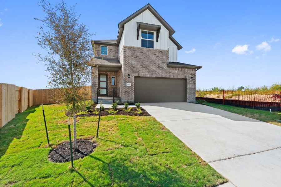 Front exterior of a new home in Terrace Collection At Turner's Crossing, Buda, TX, highlighting curb appeal (Image 25).