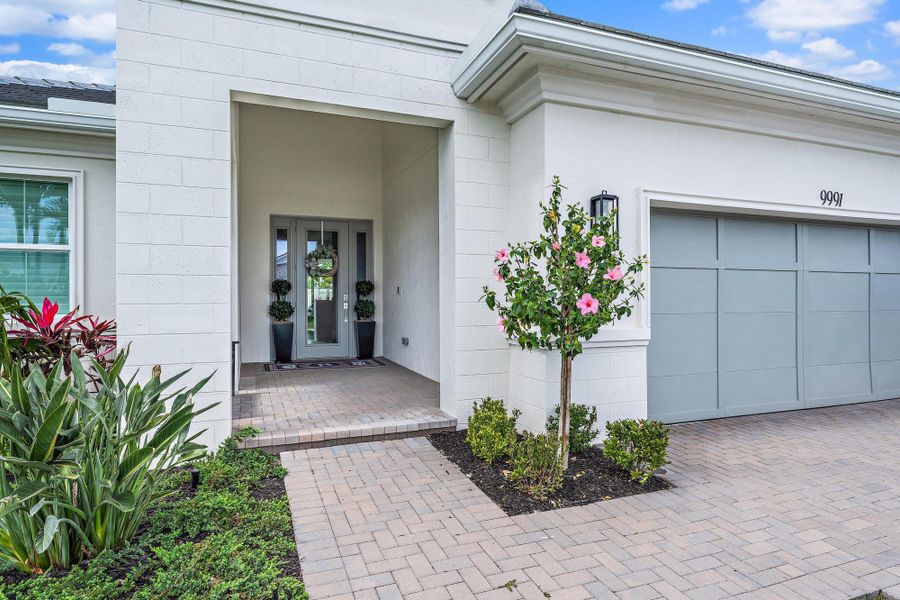 Front exterior of a new home in , Palm Beach Gardens, FL, highlighting curb appeal (Image 1).