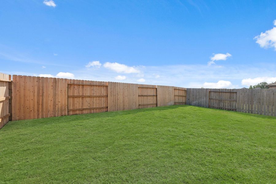 Exterior details and patio area of a home in The Trails, New Caney (Image 23).