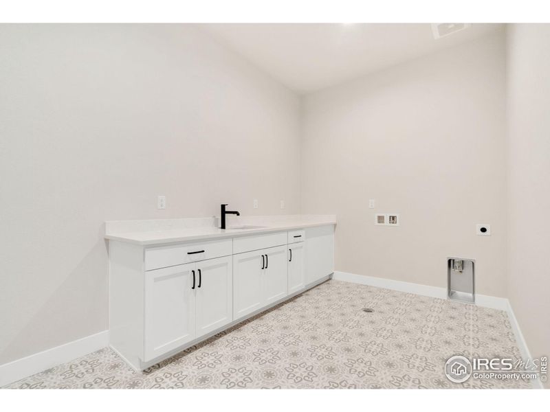 Spacious laundry with sink