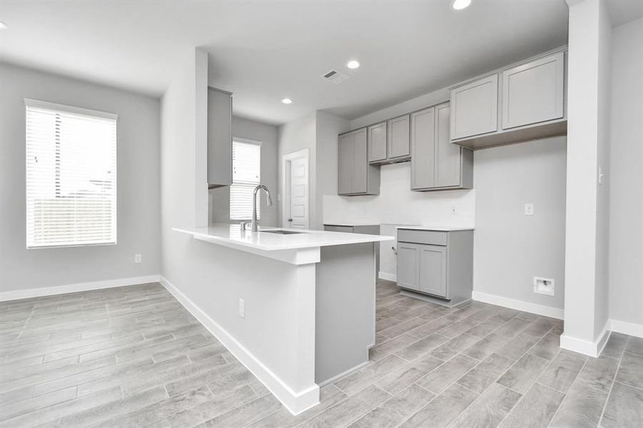 This generously spacious kitchen is a dream realized!