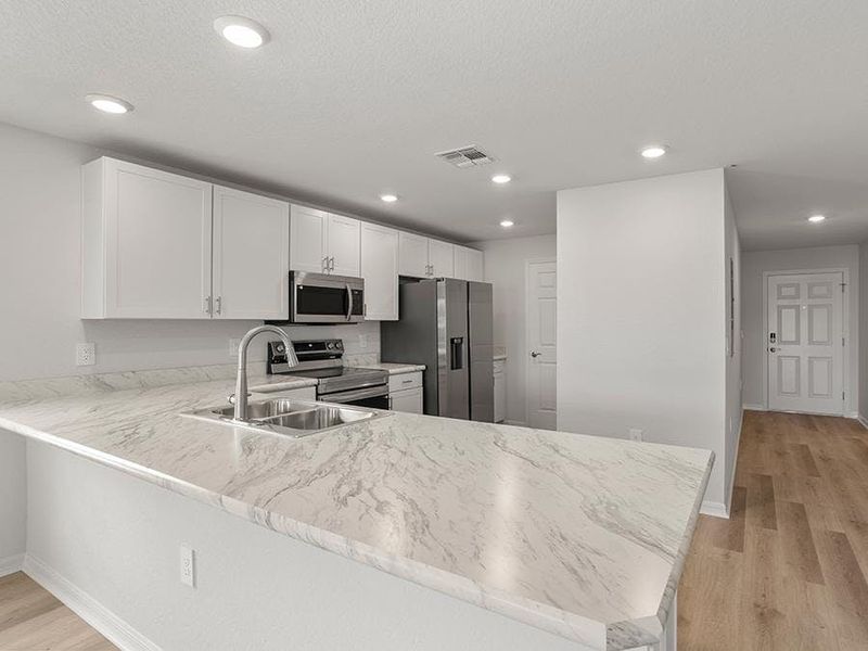 Choose from homes with warm wood or classic white finishes - Bimini townhome by Highland Homes