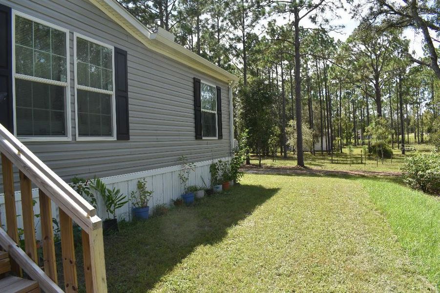 Exterior details and patio area of a home in , Williston (Image 30).
