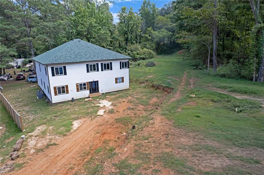 Front exterior of a new home in , Lithonia, GA, highlighting curb appeal (Image 21).