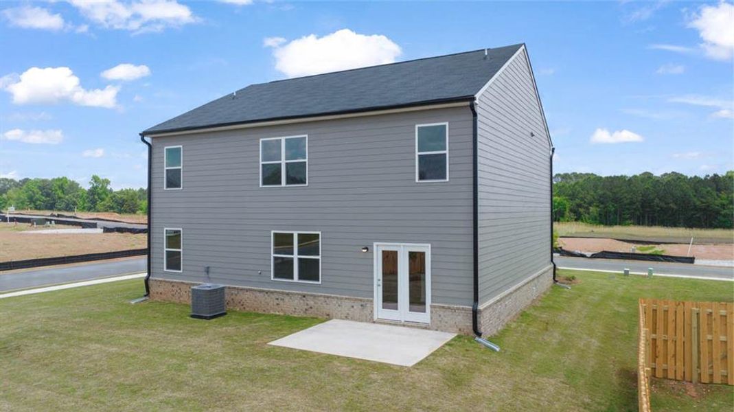 Front exterior of a new home in The Reserve at Calcutta, Stockbridge, GA, highlighting curb appeal (Image 17).