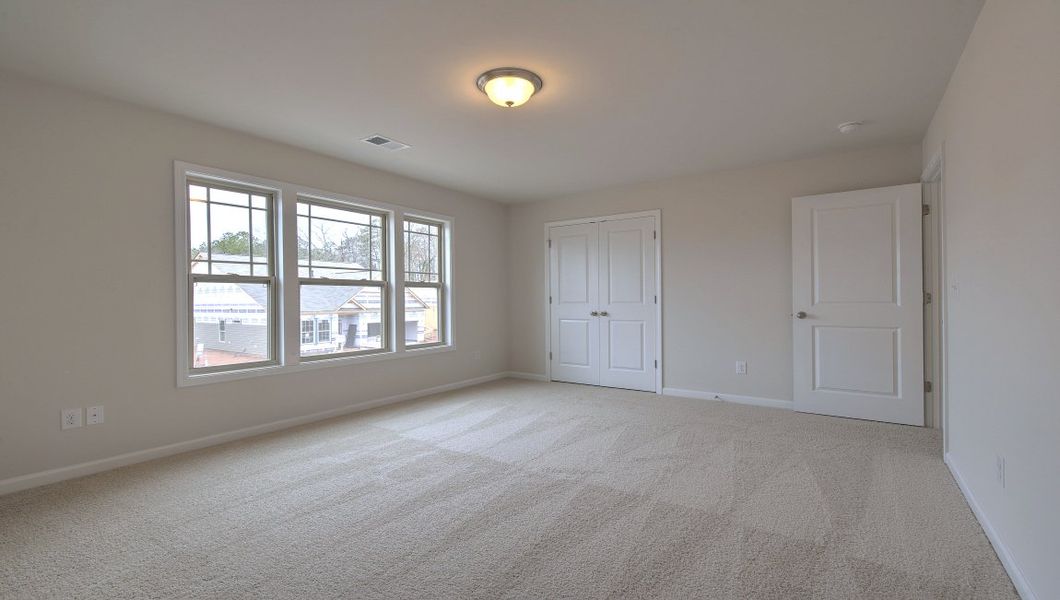 Spacious, unfurnished interior of a new home in Reserve at Tap Root Farms, Fletcher (Image 34).