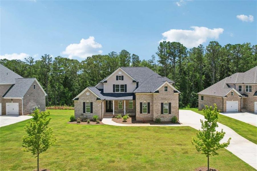 Front exterior of a new home in Whitestone, Douglasville, GA, highlighting curb appeal (Image 15).