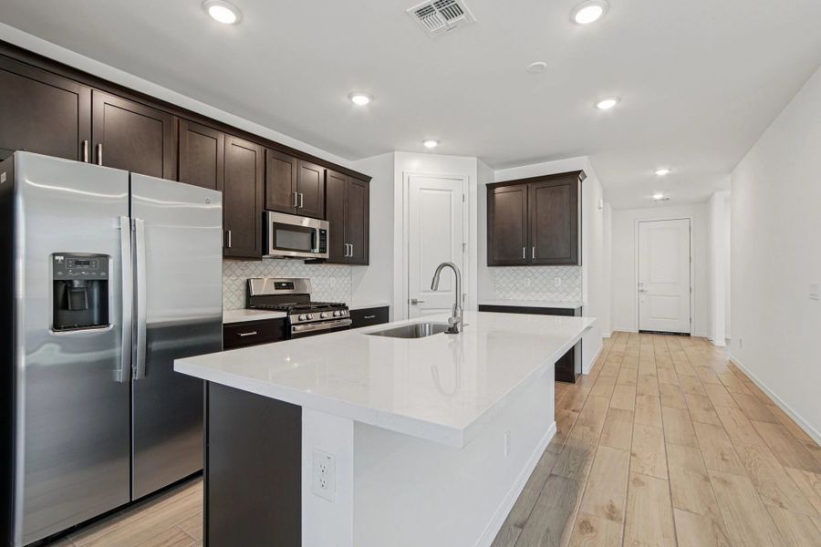 Kitchen featuring the Roosevelt Collection. Not actual home, finishes may vary by community.