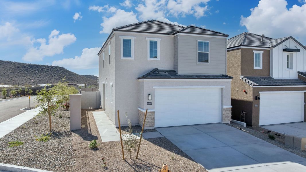 Front exterior of a new home in The Buttes at Mystic, Peoria, AZ, highlighting curb appeal (Image 2).