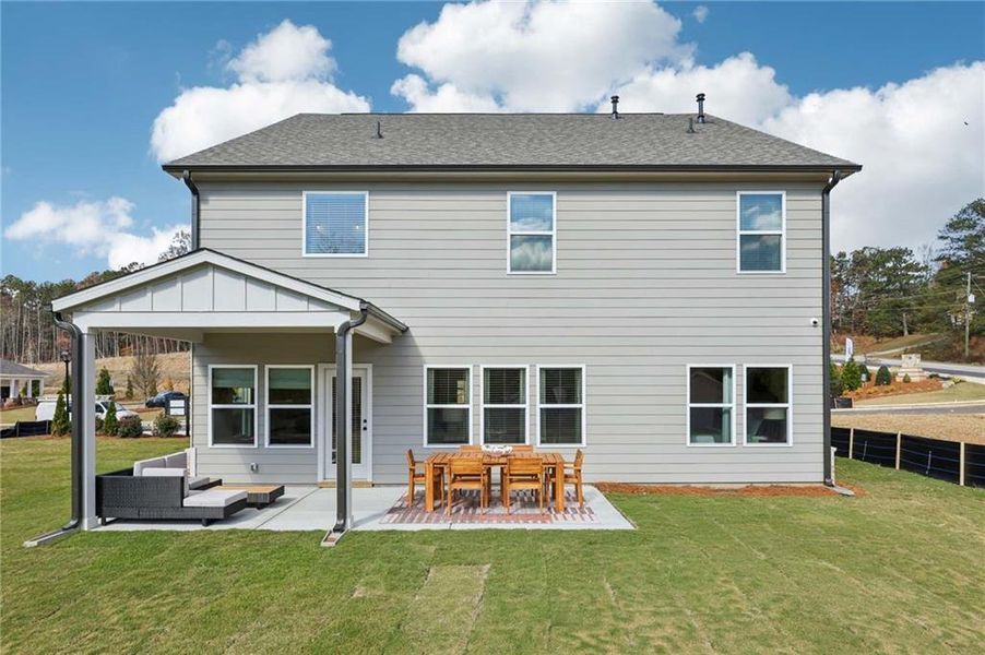 Exterior details and patio area of a home in Arbors at Richland Creek, Buford (Image 25).