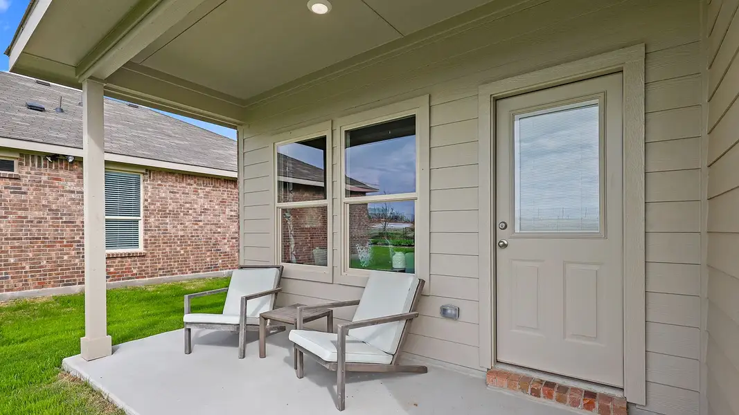 Exterior details and patio area of a home in Monarch at the Meadows, Ponder (Image 2).