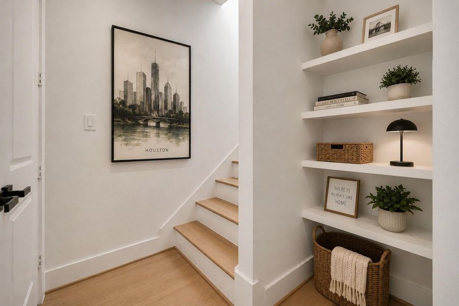 Hallway with custom built-in shelving leading to the private fourth-floor rooftop deck. Decor digitally added for illustration purposes.