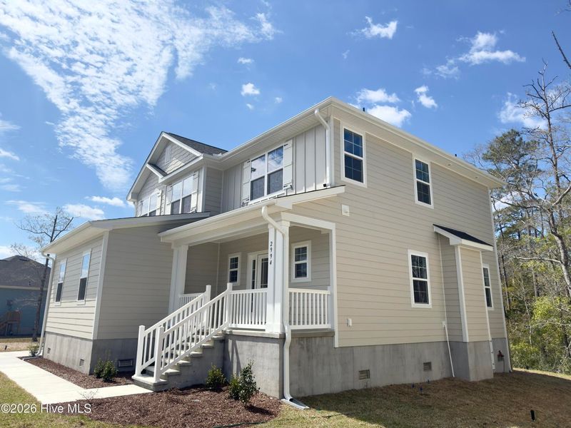 Front exterior of a new home in Rutledge, Shallotte, NC, highlighting curb appeal (Image 18).