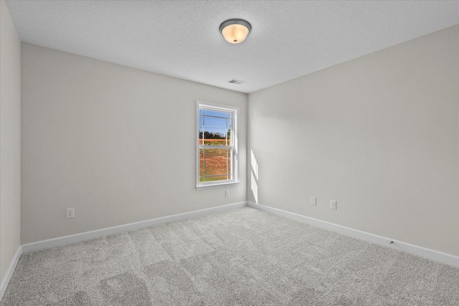 Representative unfurnished interior of a home built from the Morgan by Enchanted Homes in Lonesome Dove, San Antonio (Image 30).