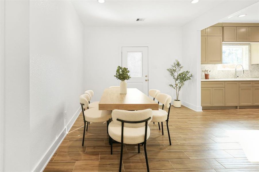 The spacious dining area, seamlessly connected to the kitchen, is perfect for entertaining and family gatherings.