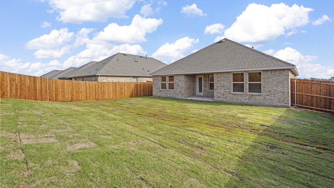 Exterior details and patio area of a home in Trailstone, Caddo Mills (Image 25).