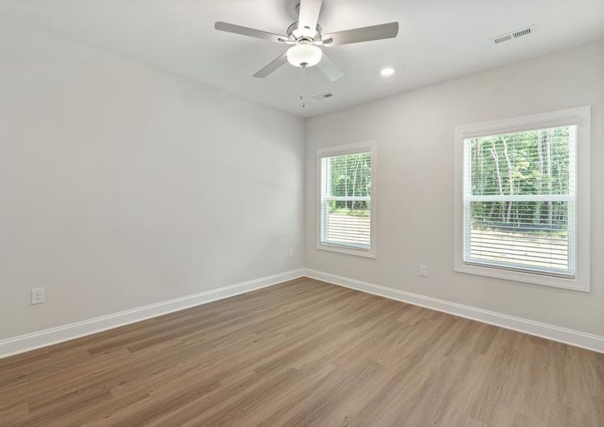 Master bedroom with two windows.