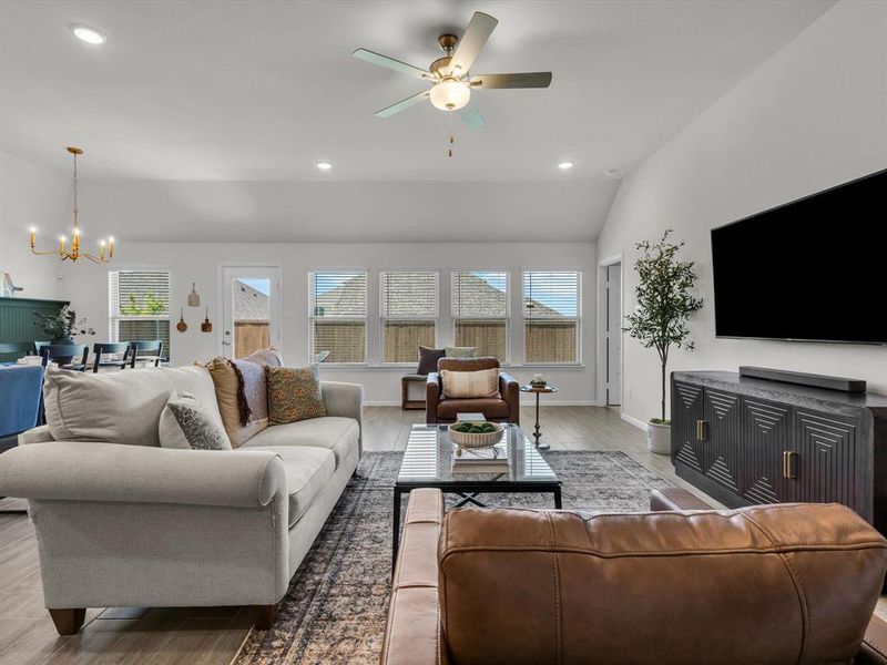 A
wall of windows along the back of the home brings in abundant natural light, making the entire space feel open and airy.