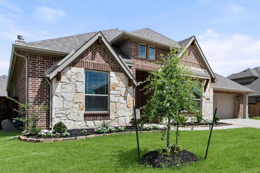 Front exterior of a new home in Somerset, Mansfield, TX, highlighting curb appeal (Image 2). Front exterior of a new home in Somerset, Mansfield, TX, highlighting curb appeal (Image 2).
