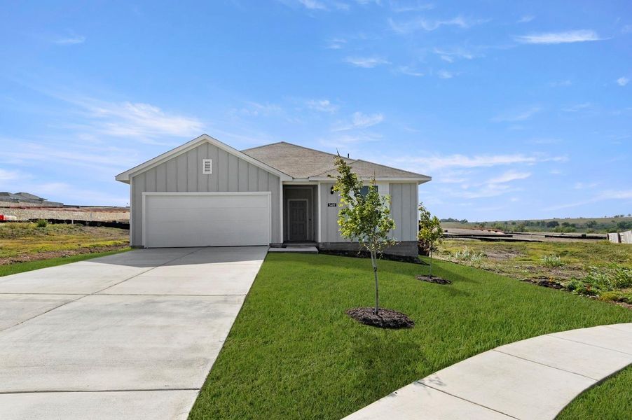 Front exterior of a new home in Cloverleaf, Austin, TX, highlighting curb appeal (Image 18).