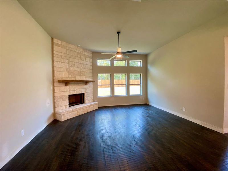 Large family room with huge garden view & beautiful stone gas fireplace Large family room with huge garden view & beautiful stone gas fireplace