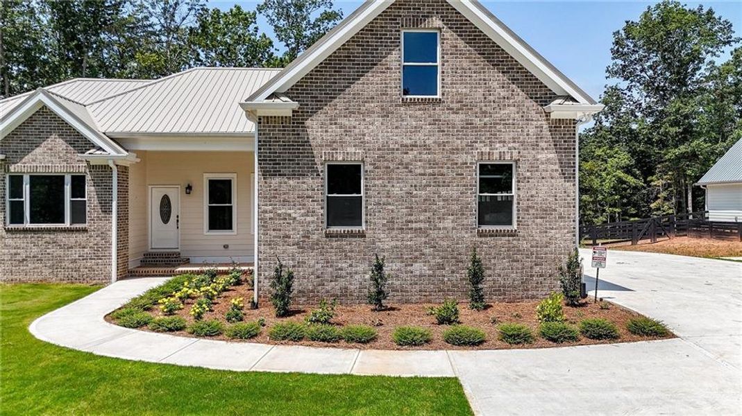Front exterior of a new home in , Canton, GA, highlighting curb appeal (Image 2).