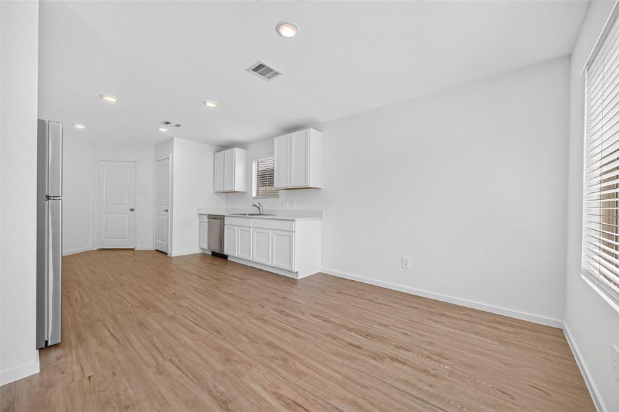 Kitchen area and breakfast area are right next to each other. Kitchen area and breakfast area are right next to each other.