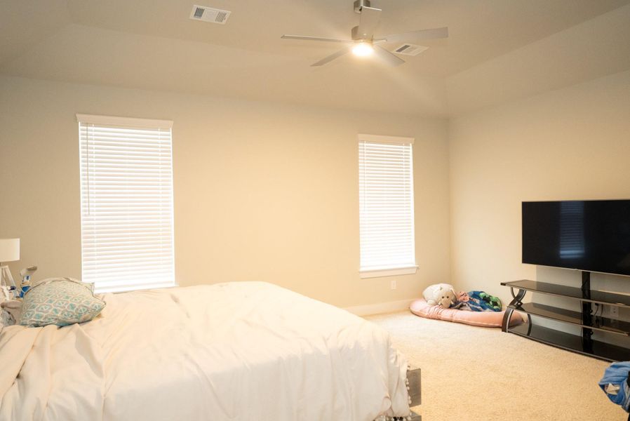 Furnished interior view inside a new home in Sunterra, Katy (Image 40).