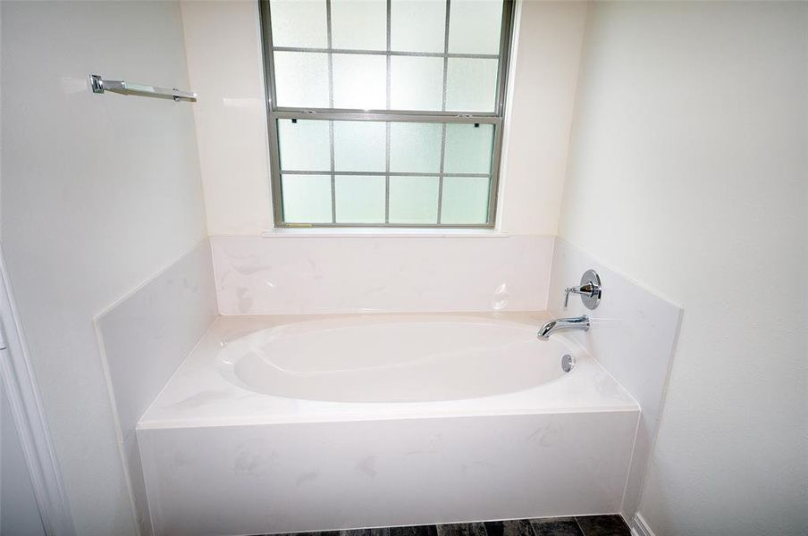 6 foot soaker tub in master bath.