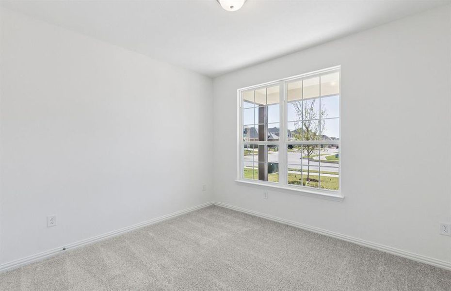 Spacious secondary bedroom with large windows Spacious secondary bedroom with large windows