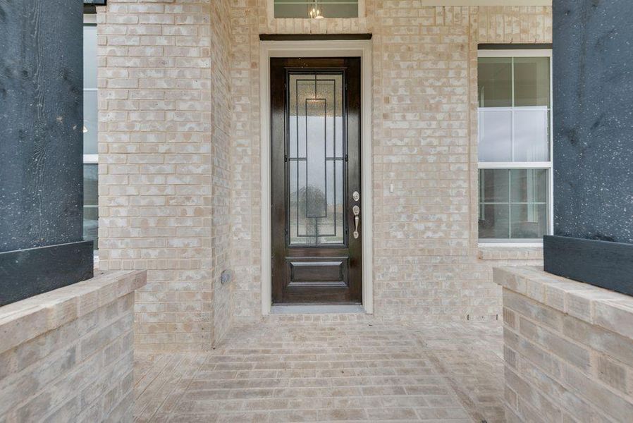 Front exterior of a new home in Prairie Ridge, Midlothian, TX, highlighting curb appeal (Image 1). Front exterior of a new home in Prairie Ridge, Midlothian, TX, highlighting curb appeal (Image 1).