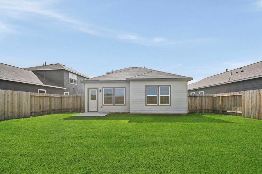 Exterior details and patio area of a home in Barrett Crossing, Crosby (Image 4).