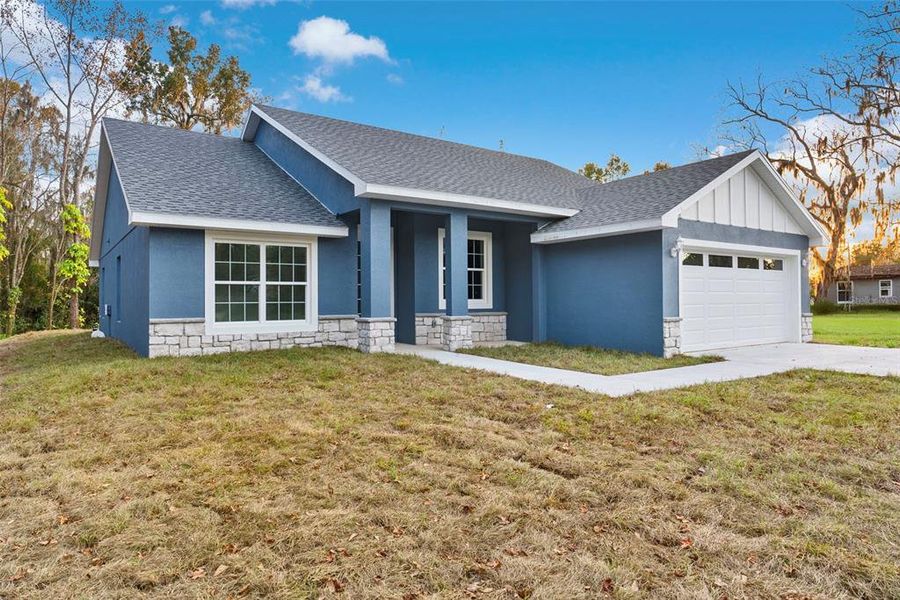 Front exterior of a new home in , Lakeland, FL, highlighting curb appeal (Image 18).