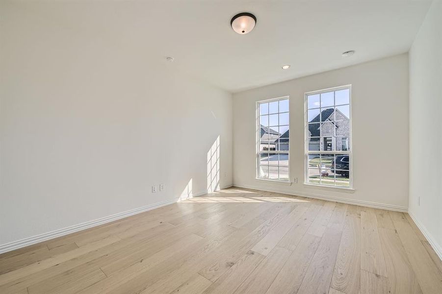 Spare room with light wood-type flooring