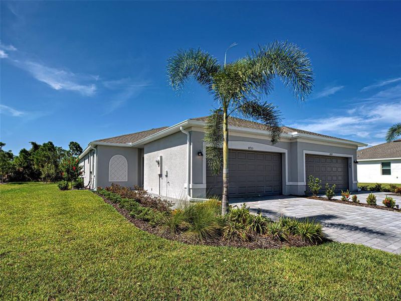 Front exterior of a new home in , Englewood, FL, highlighting curb appeal (Image 23).